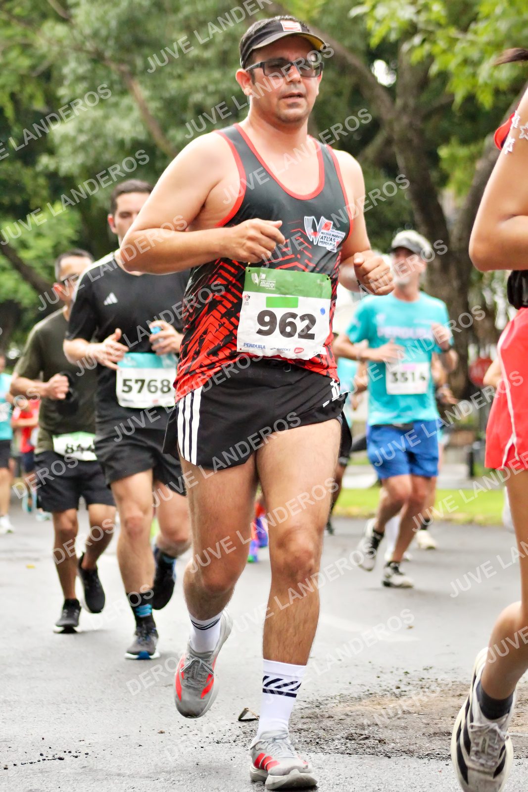 Foto del MEDIO MARATÓN ATLAS en Av. Patria, frente al Parque El Polvorín, Zapopan a las 08:24 · dorsal 962, 5768, 3514, 844