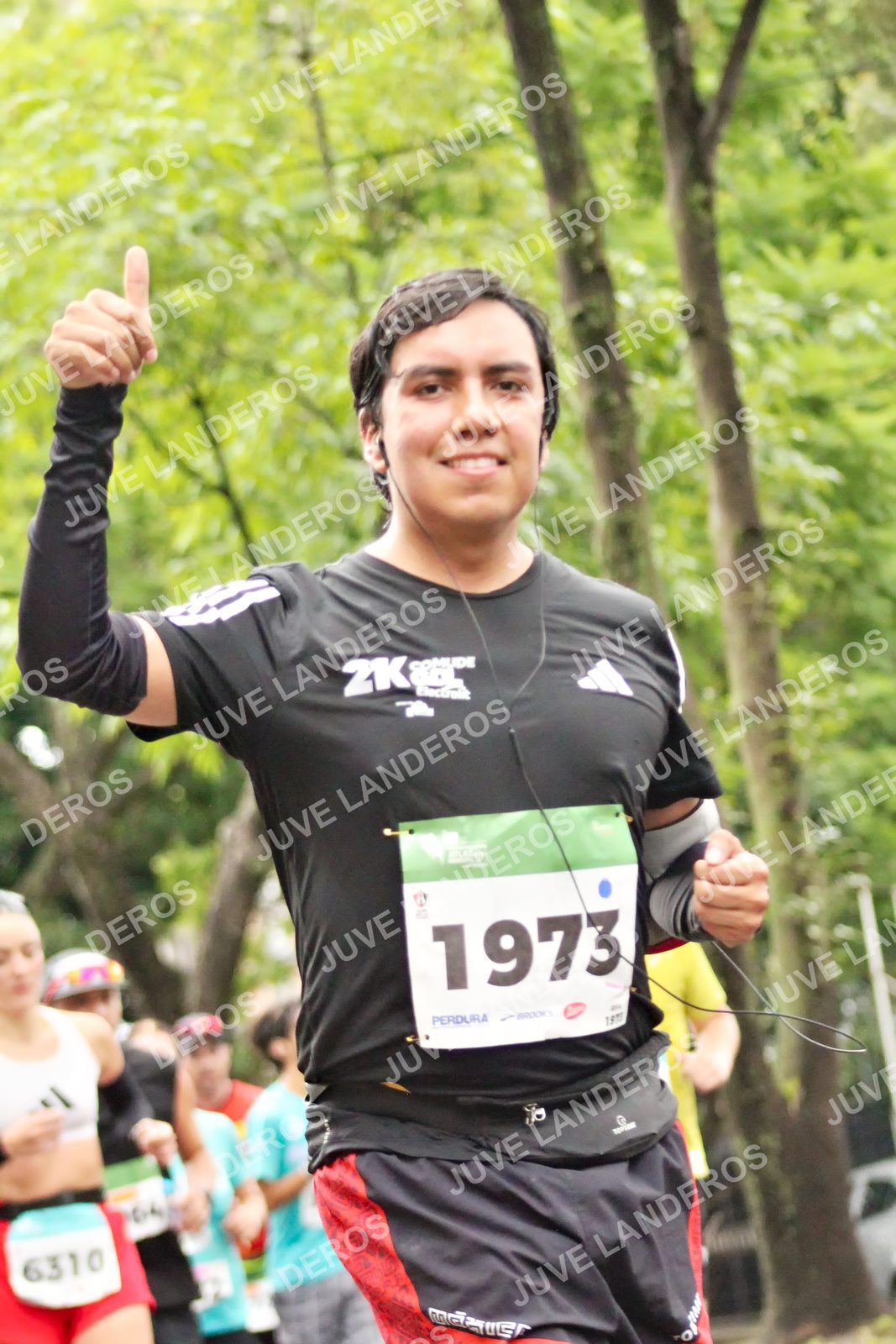 Foto del MEDIO MARATÓN ATLAS en Av. Patria, frente al Parque El Polvorín, Zapopan a las 08:31 · dorsal 1973, 6310