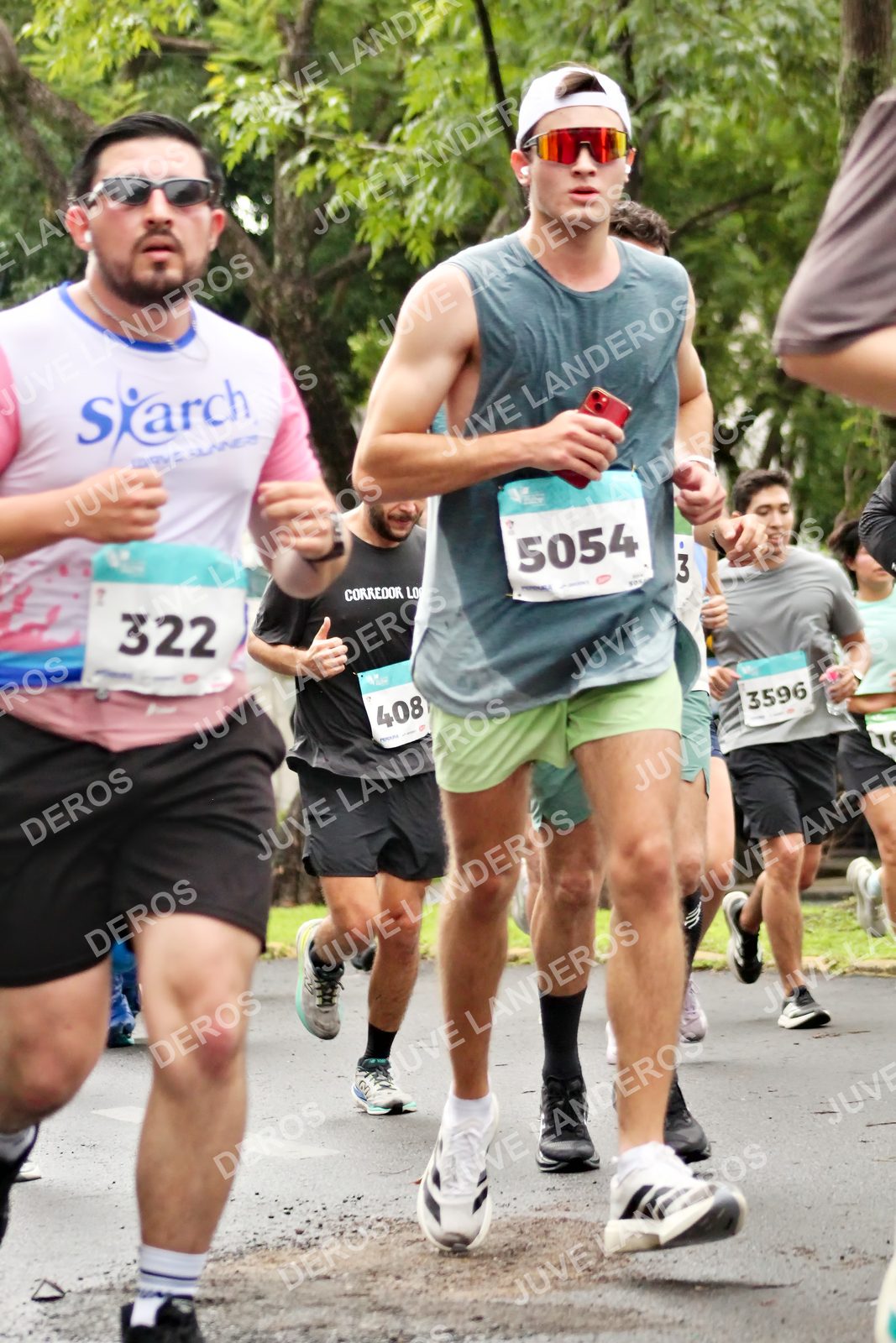 Foto del MEDIO MARATÓN ATLAS en Av. Patria, frente al Parque El Polvorín, Zapopan a las 08:26 · dorsal 322, 5054, 408, 3596