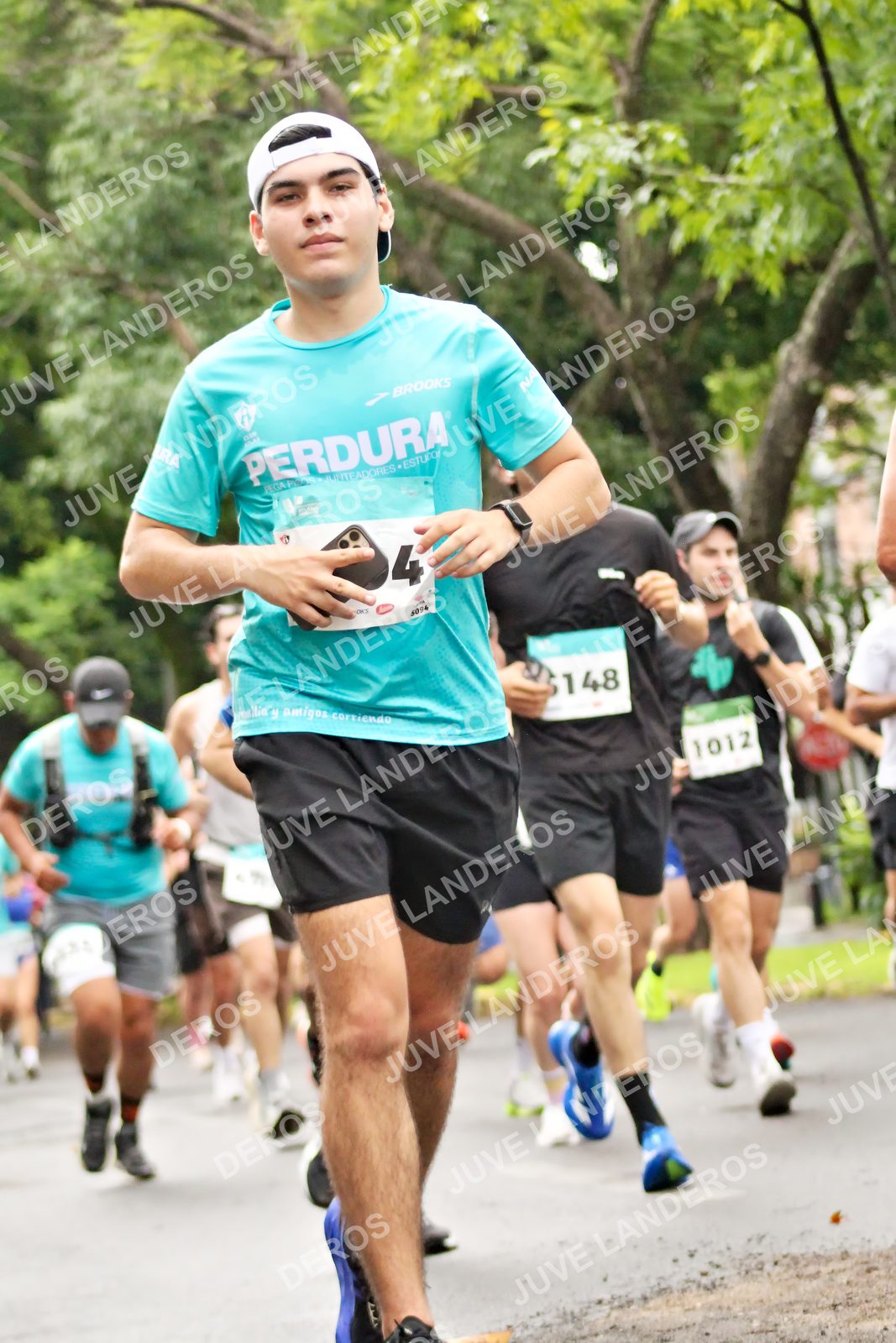Foto del MEDIO MARATÓN ATLAS en Av. Patria, frente al Parque El Polvorín, Zapopan a las 08:26 · dorsal 4, 1012, 148