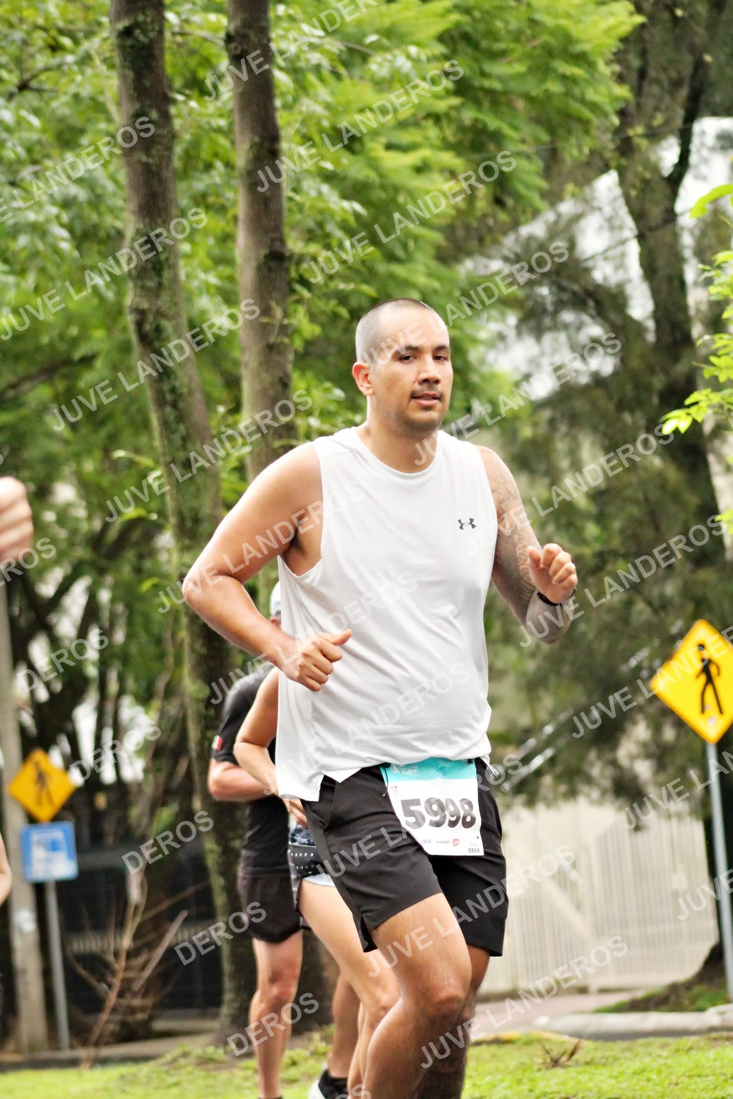 Foto del MEDIO MARATÓN ATLAS en Av. Patria, frente al Parque El Polvorín, Zapopan a las 08:21 · dorsal 5998