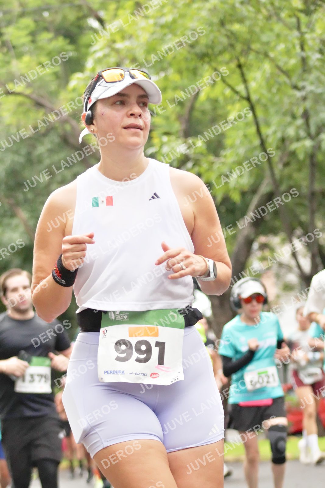 Foto del MEDIO MARATÓN ATLAS en Av. Patria, frente al Parque El Polvorín, Zapopan a las 08:28 · dorsal 991, 379, 6021, 91