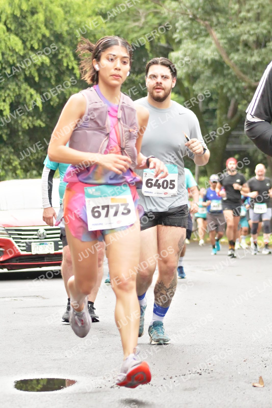 Foto del MEDIO MARATÓN ATLAS en Av. Patria, frente al Parque El Polvorín, Zapopan a las 08:42 · dorsal 6405, 6773