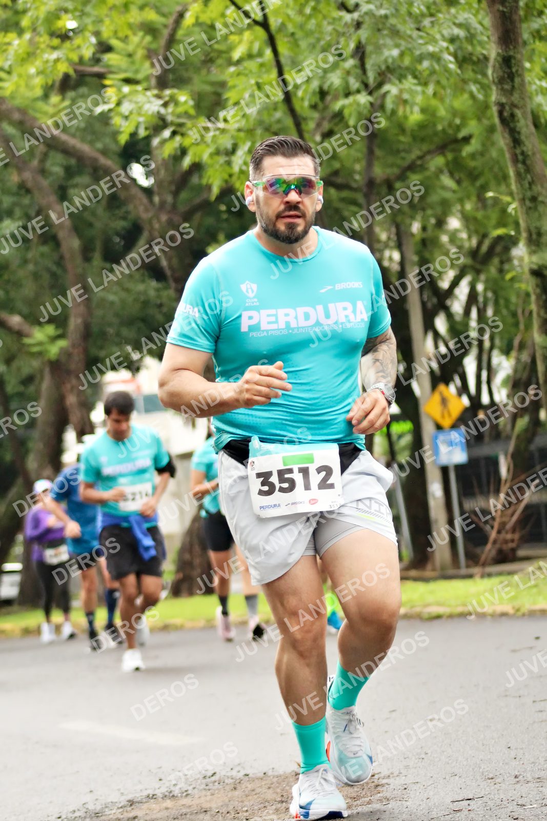 Foto del MEDIO MARATÓN ATLAS en Av. Patria, frente al Parque El Polvorín, Zapopan a las 08:37 · dorsal 3512, 214